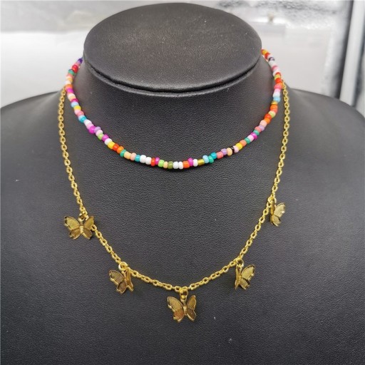 Damesketting met vlinders en kralen
