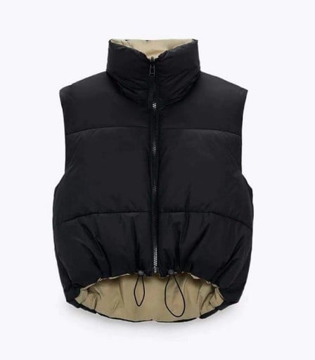 Dámská krátká prošívaná vesta bez rukávů Vysoký stojáček a zapínání na zip Stahovací šňůrka v dolním lemu Polyester a bavlna