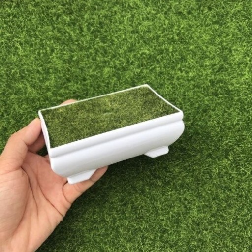 Decoratieve bloempot met kunstgras