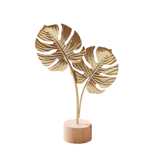 Dekoratiivinen metallinen monstera puualustalla 19,5 cm metalli ja puu kultainen ja luonnollinen koriste pöydälle tai hyllylle