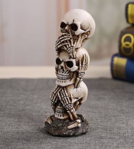 Dekorativ statuette med kranier