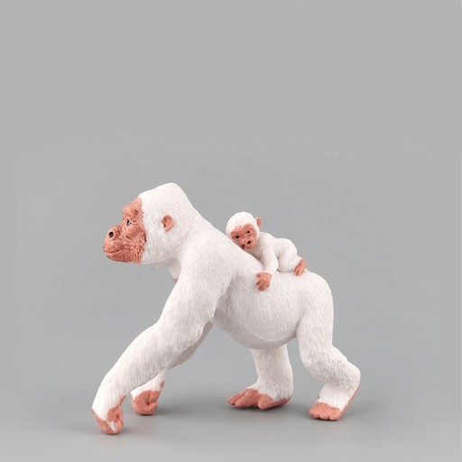 Figurină albă de gorilă și pui