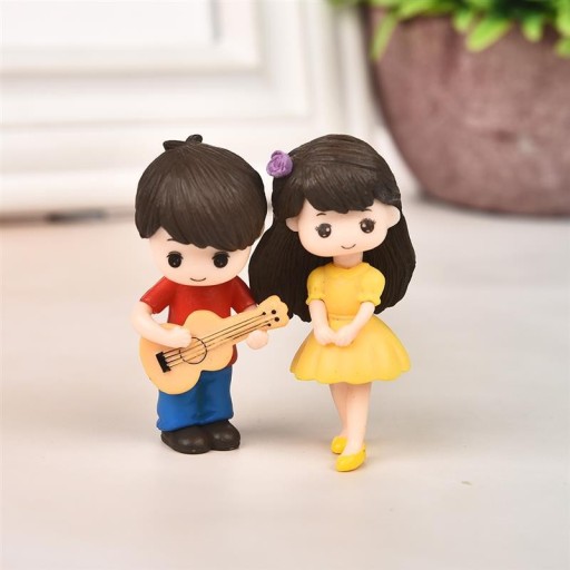 Figurines décoratives garçon et fille