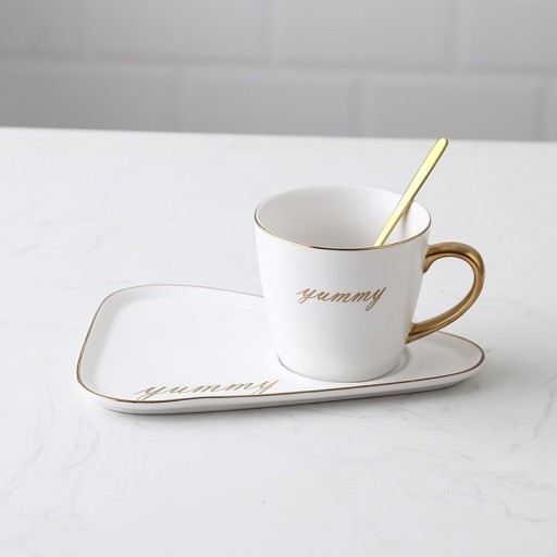 Juego de té de cerámica taza 260 ml con plato y cuchara Asa dorada y inscripción decorativa Plato alargado 20 x 14 cm con espacio