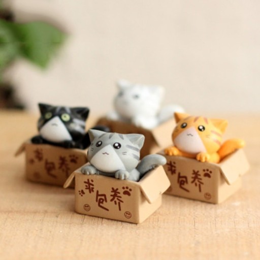 Miniature décorative chat dans une boîte