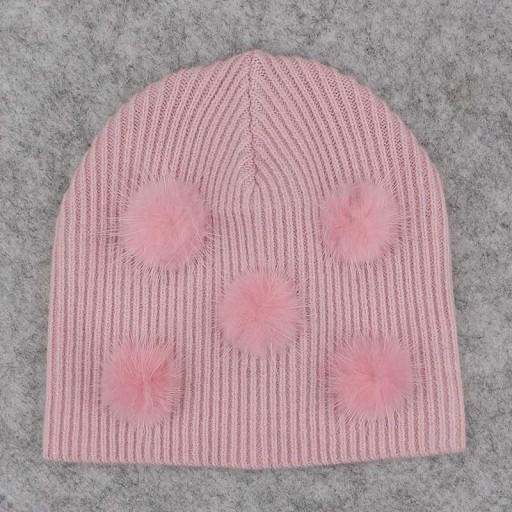 Natasha kindermuts met pompons