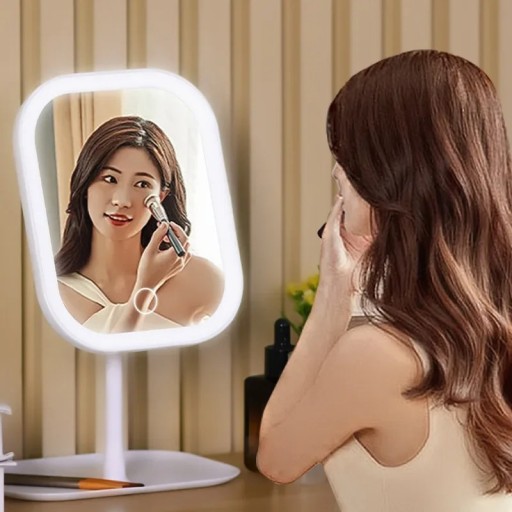 Oglindă cosmetică LED cu suport 27 x 18 cm Control tactil Rotație la 270° Trei temperaturi de lumină Memorie luminozitate Reîncărcabilă Alb sau roz