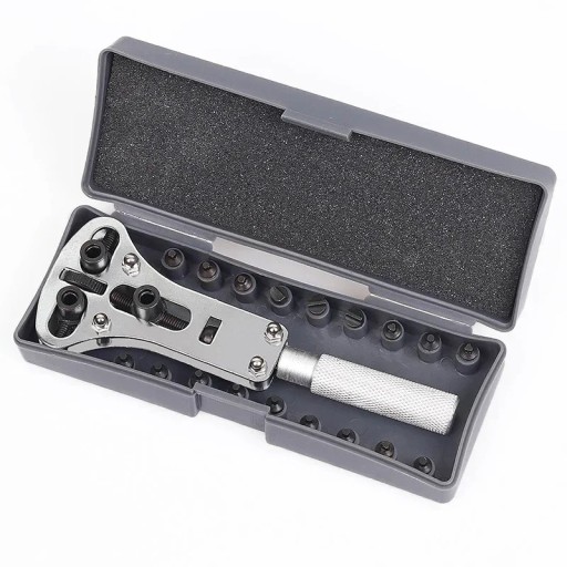Ouvre-capsules professionnel pour montres avec 3 mâchoires et 18 embouts dans un étui de protection pour service et remplacement de piles