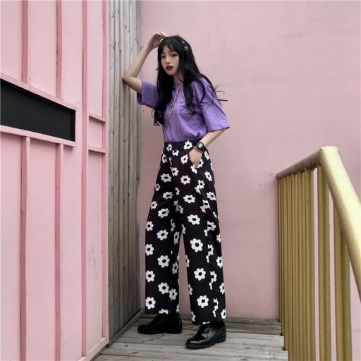 Pantalons dames noir et blanc avec des fleurs
