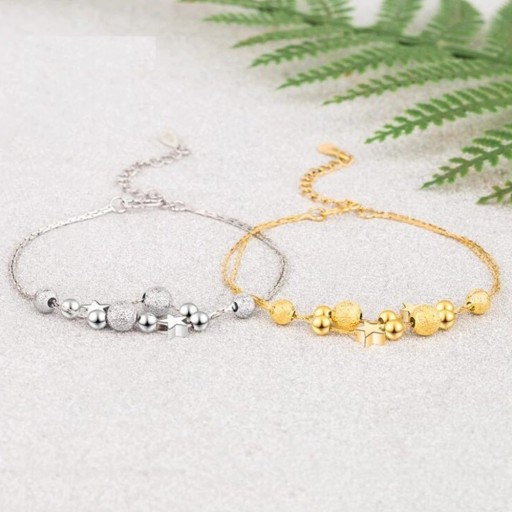 Pulseira feminina com bolas e estrelas