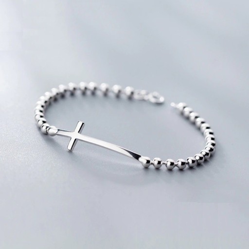 Pulsera de mujer con bolas y cruz