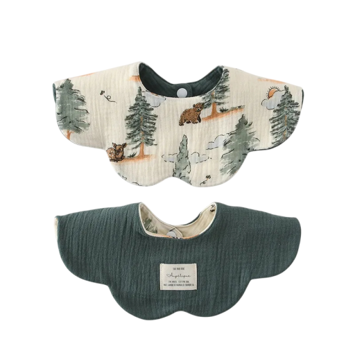 Reversible Bib for Children Beige Side with Mountain Motif of Conifers and Animals Dark Green Smooth Side Wavy Edge Snap Fastener at Neck