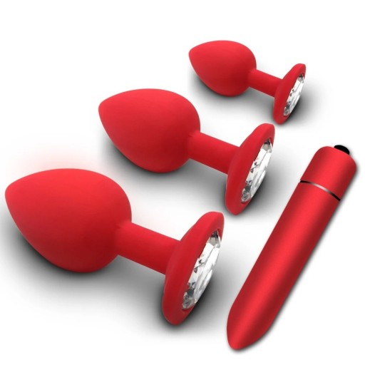 Set de tres tapones anales rojos de diferentes tamaños con piedra transparente extraíble y vibrador. Embalaje discreto.