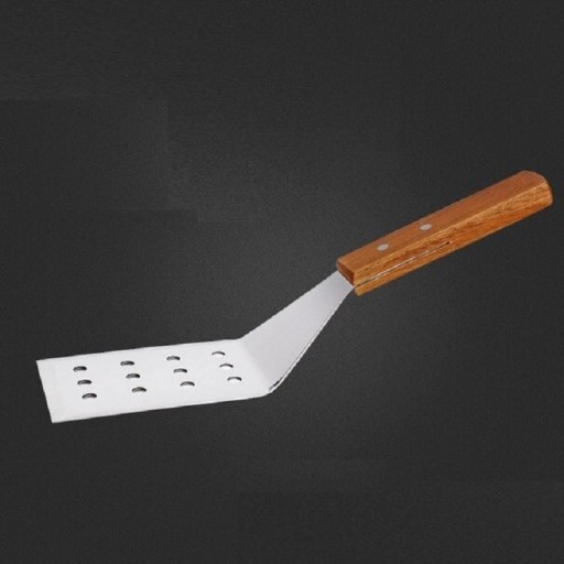 Spatule en acier inoxydable avec des trous
