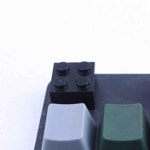 Tecla intercambiável em forma de cubo