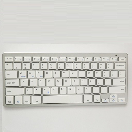 Teclado Bluetooth sem fios compacto sem parte numérica Teclas de membrana Alimentado por pilhas AAA Plástico prateado Dimensões 28,5 x 12,1 x 2,1 cm