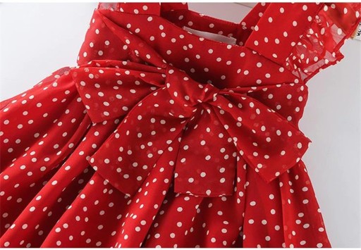 Tyttöjen mekko, jossa on pilkkuja