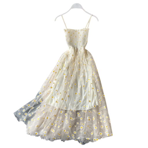Vestido largo con estampado floral sobre tul. Corpiño de tiras con volantes y falda doble con capa transparente. Vestido romántico de verano.