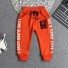 Chłopięce spodnie dresowe L2257 pomarańczowy