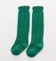 Ciorapii colorati ai fetelor verde