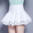 Dámska mini sukňa s volánikmi biela