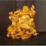 Dekoracyjna statuetka przedstawiająca uśmiechniętego Buddy złoto