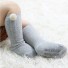 Detské ponožky s brmbolcami svetlo sivá