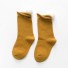 Dievčenské ponožky s brmbolcami tmavo žltá
