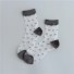 Durchsichtige Damensocken mit Punkten grau