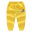 Dziecięce spodnie dresowe T2436 żółty