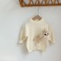 Kinderpullover mit Bär creme