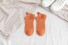 Női zokni vicces hímzéssel narancs