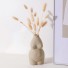 Vaza decorativă în formă de corp de femeie gri